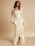 Front three-quarter view of an ivory lace maxi dress with square neckline, flared cuffs and cascading ruffle hem for evening wear