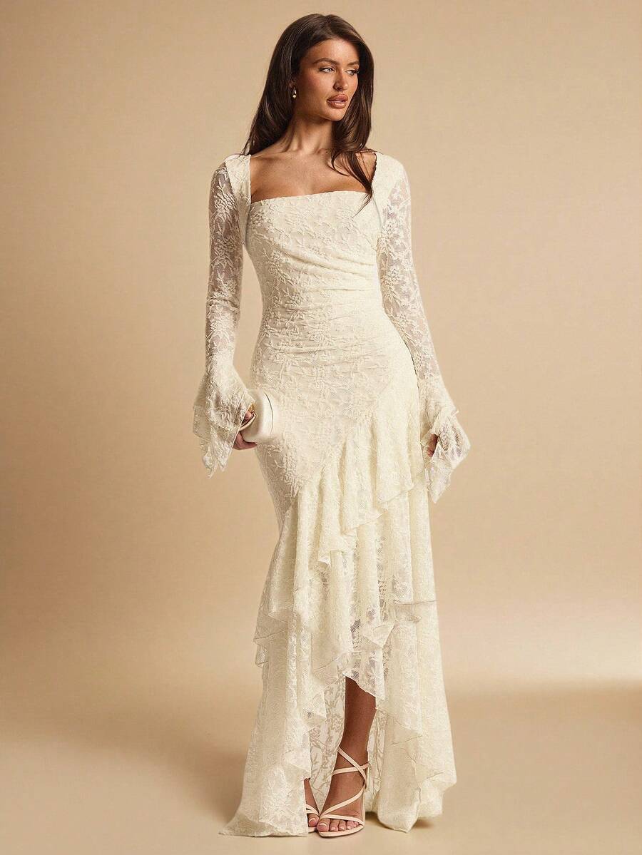 Front three-quarter view of an ivory lace maxi dress with square neckline, flared cuffs and cascading ruffle hem for evening wear