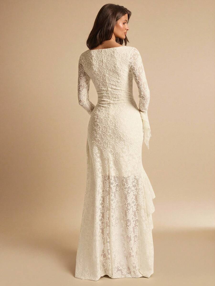 Back view of an ivory botanical lace maxi dress showing the fitted waist, long sleeves and floor-length skirt
