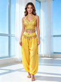 Yellow embellished halter crop top and coin-trim harem trousers front view