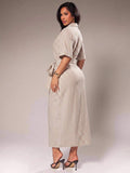 Back view of apricot striped shirt dress with waist tie