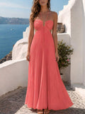 Coral pink pleated open-back maxi dress with tie closure, rear view