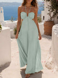 Mint green pleated open-back maxi dress with crossed straps, rear view