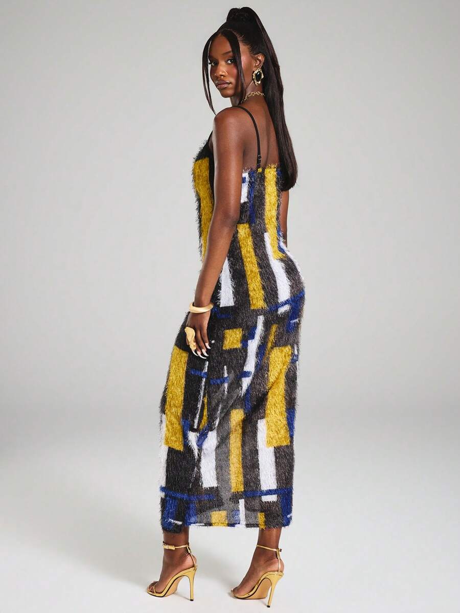 Back view of fitted color block maxi slip dress with thin straps and straight hem