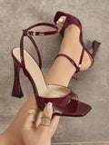 Burgundy patent square-toe sandal with flared heel and T-strap