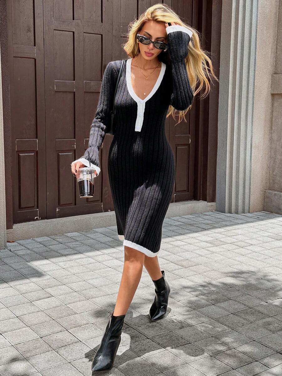 Black rib-knit fitted midi dress with white V-neck button placket, shown walking outdoors with ankle boots