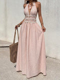 Front view of pink halter maxi dress with shell-trimmed high waist