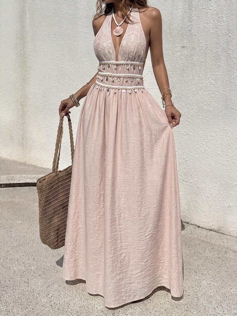 Front view of pink halter maxi dress with shell-trimmed high waist