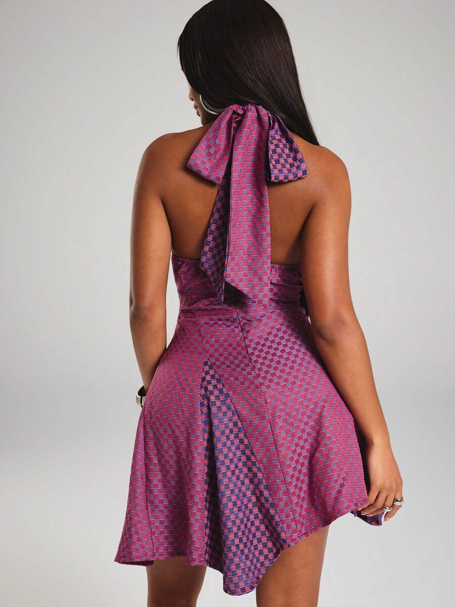 Back full view of plaid halter mini dress with open back, tie straps and fitted waist