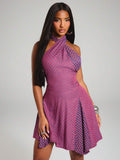 Front mid view of plaid cross-neck halter dress with fitted waist and flared mini skirt