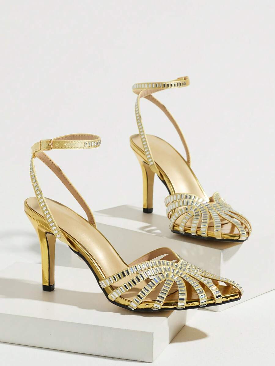 Gold open-toe stiletto sandal with sparkling rhinestone straps