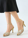 Gold open-toe rhinestone stiletto sandal with crystal ankle strap