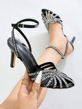 Black open-toe stiletto sandal with square rhinestone cage straps
