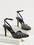 Black open-toe stiletto sandal with sparkling rhinestone straps