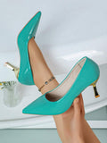 Colorful court pumps showing pointed vamp and gold heel detail