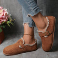Front angled pair view of camel fabric loafers with cream lace and gold buckles