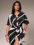 Close view of black and white diagonal striped tie waist dress
