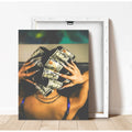 Unframed warm color dollar bill portrait beside a frame