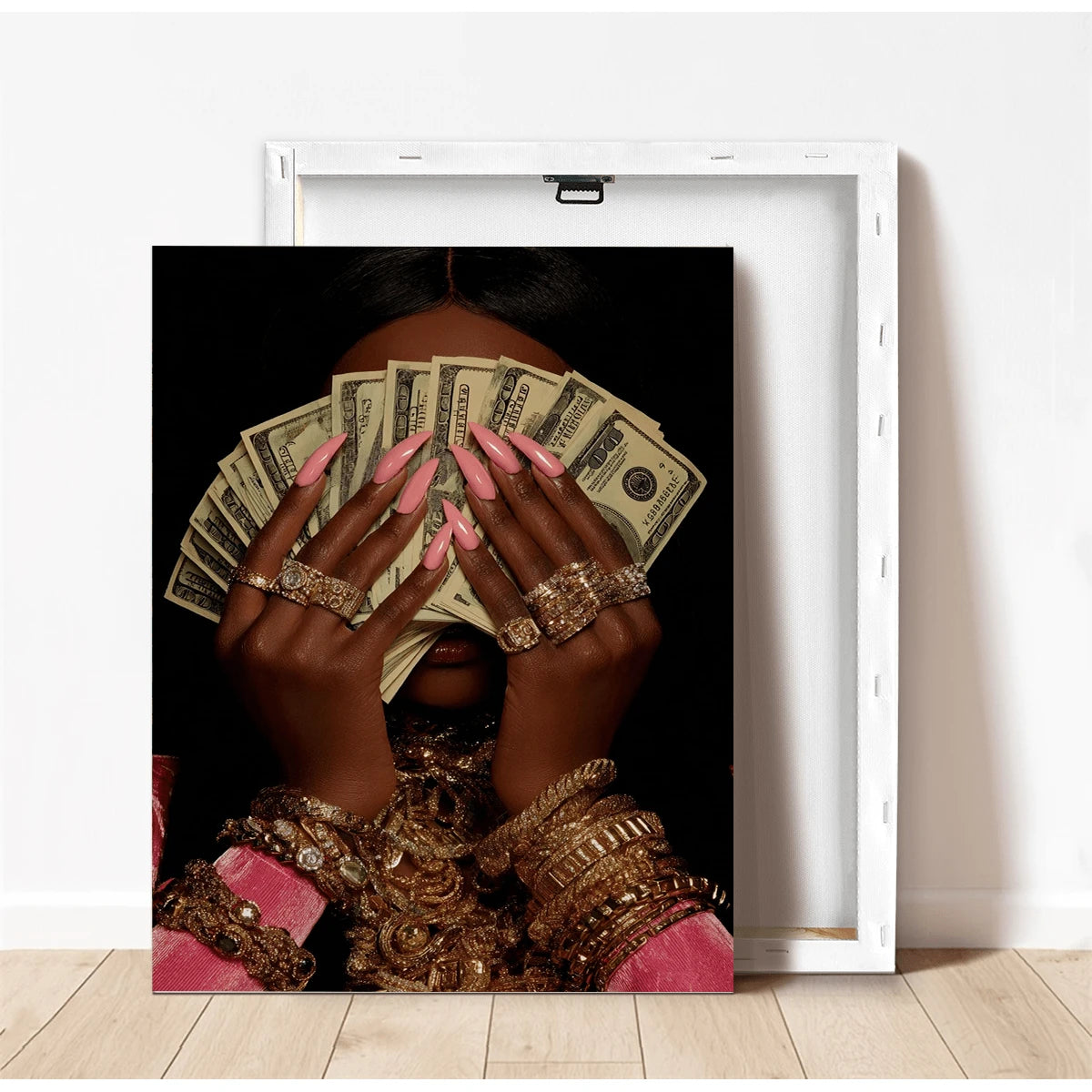 Unframed money portrait canvas beside a white frame detail