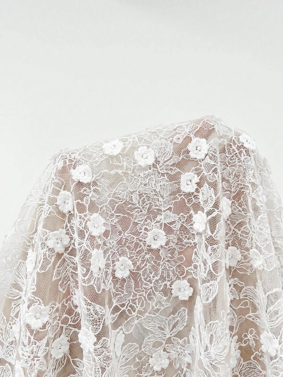Back view of ivory lace-up corset and satin mermaid maxi skirt