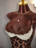 Close-up of brown and ivory floral lace neckline on leopard cami mini dress