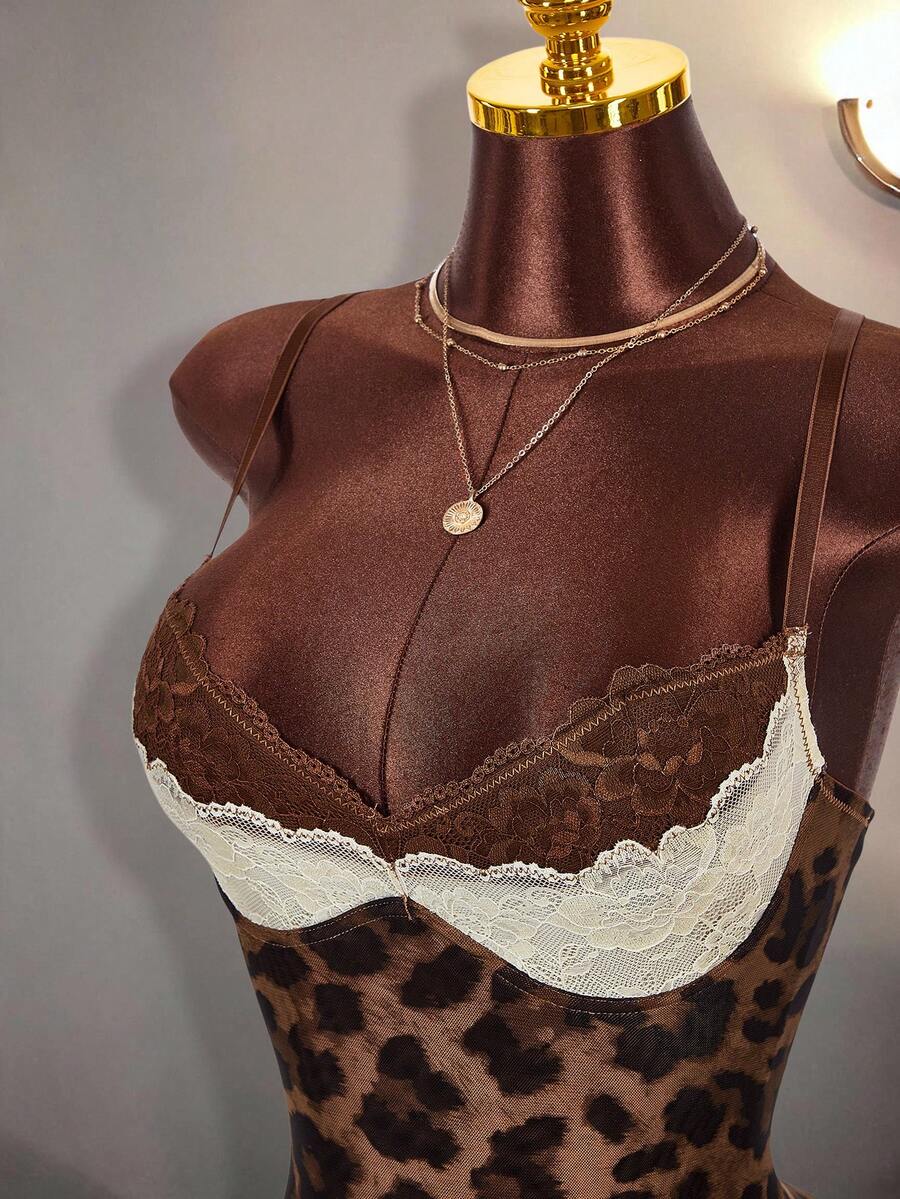 Close-up of brown and ivory floral lace neckline on leopard cami mini dress