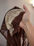Close-up of floral lace bust panel and mesh fabric on leopard bodycon dress