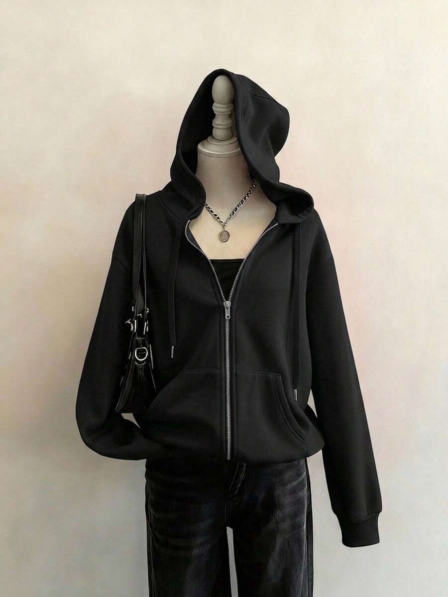 Front view of black hooded zip-up sweatshirt with drawstrings and kangaroo pockets