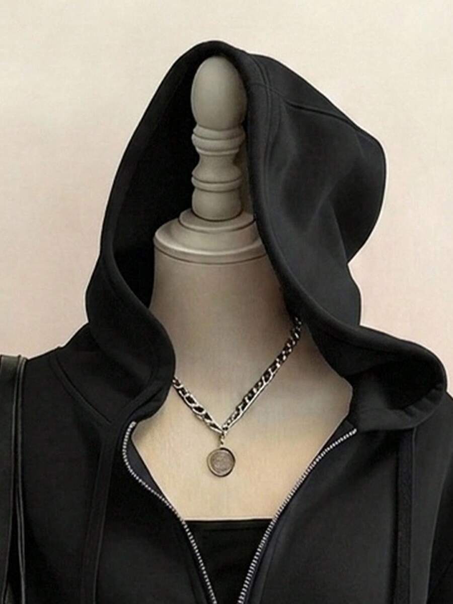 Close front view of black spiderweb hoodie with drawstring hood and zipper