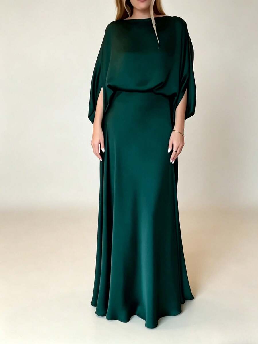 Deep green glossy evening gown with boat neckline and flowing batwing sleeves, studio view