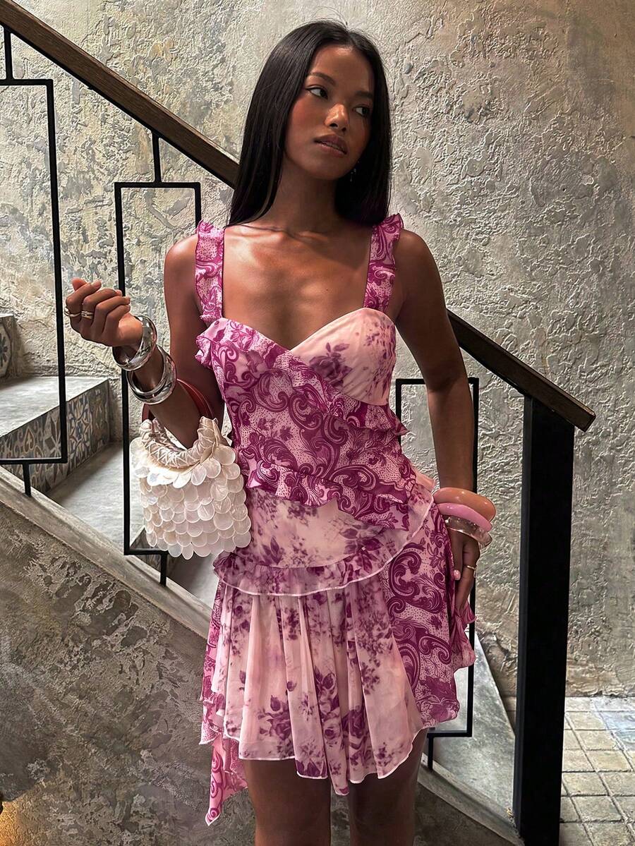 Close view of floral paisley print and layered asymmetric mini skirt