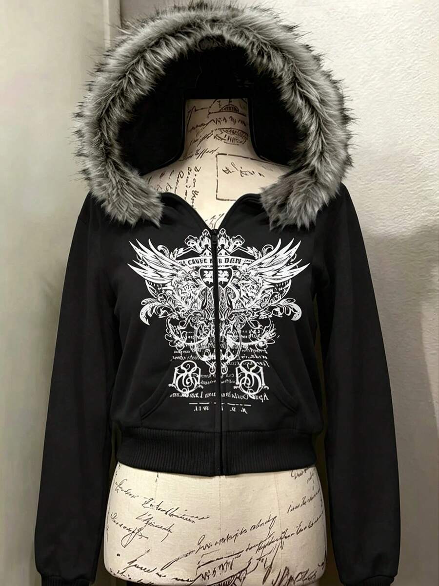 Front view of black hooded zip-up jacket with white wing graphic and faux-fur trim