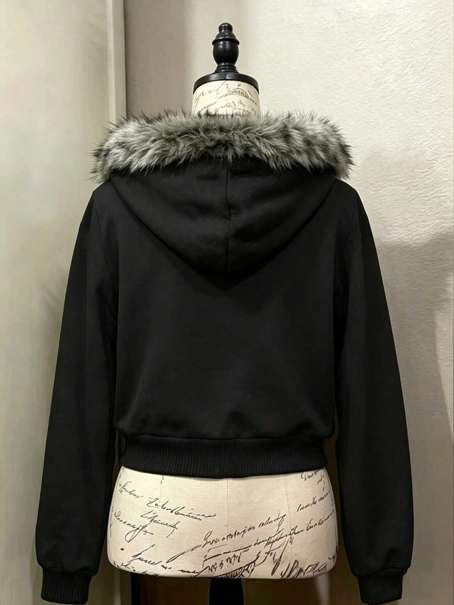 Back view of black hooded zip-up jacket with faux-fur trimmed hood