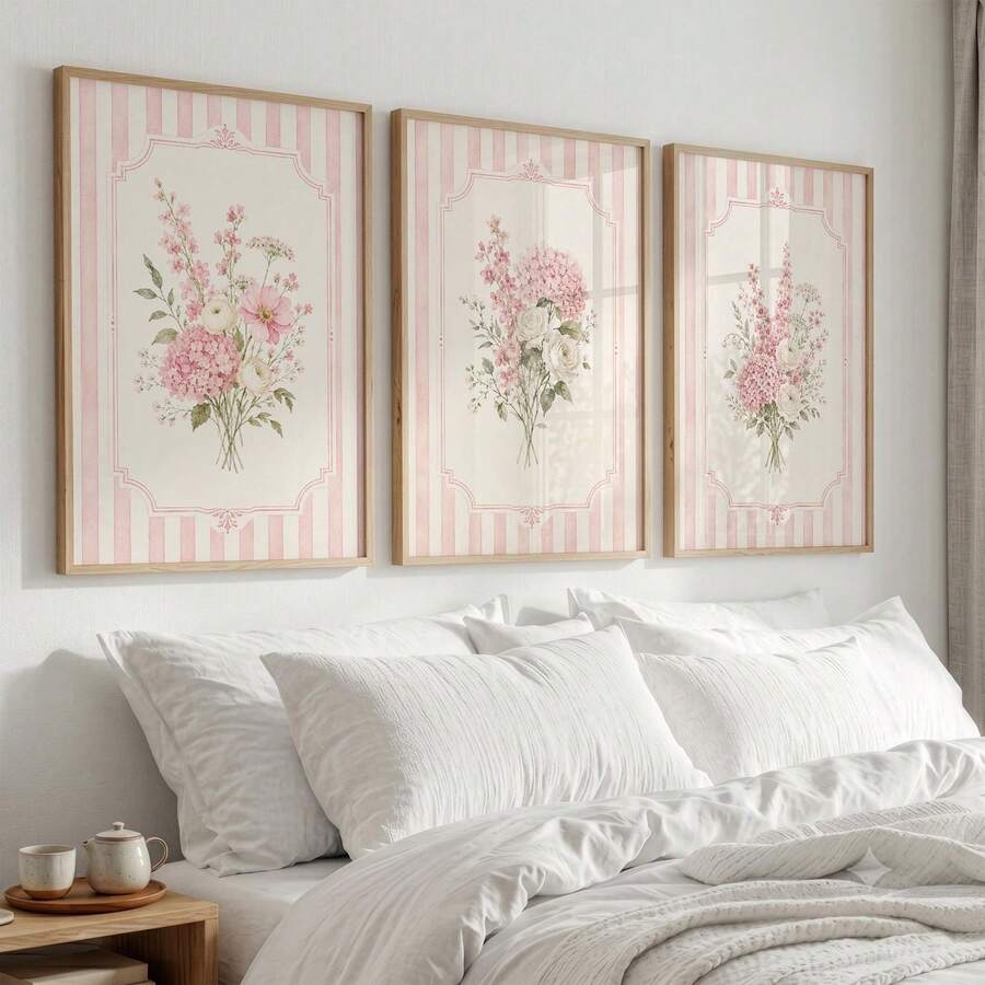 Pair of pink striped wildflower canvas prints with cream and blush floral bouquets in pale wood frames