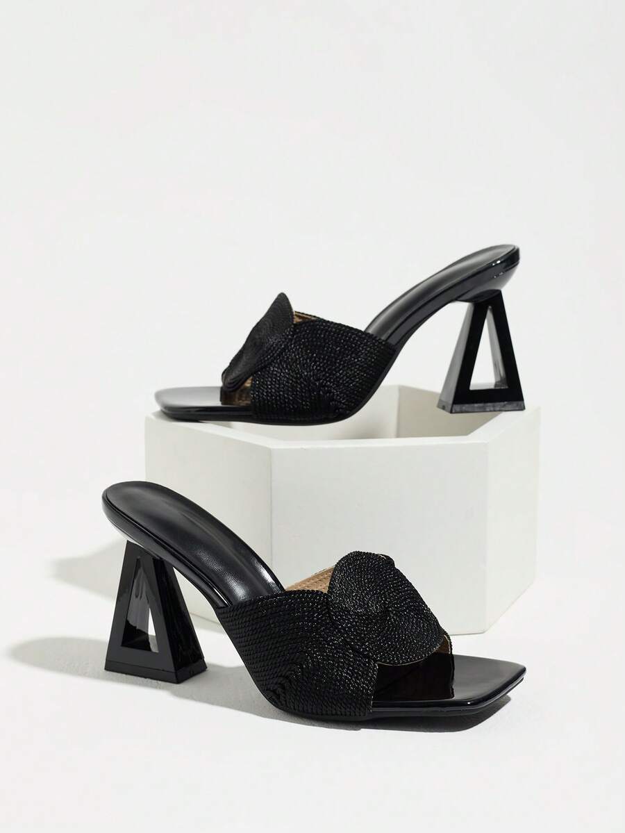 Black woven bow vamp square-toe mule pair with hollow trapezoid heels