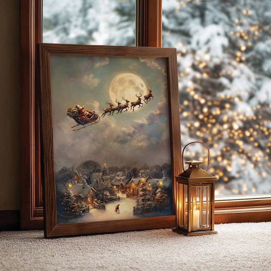 Angled dark wood frame displaying moonlit Santa sleigh canvas art beside a winter window.