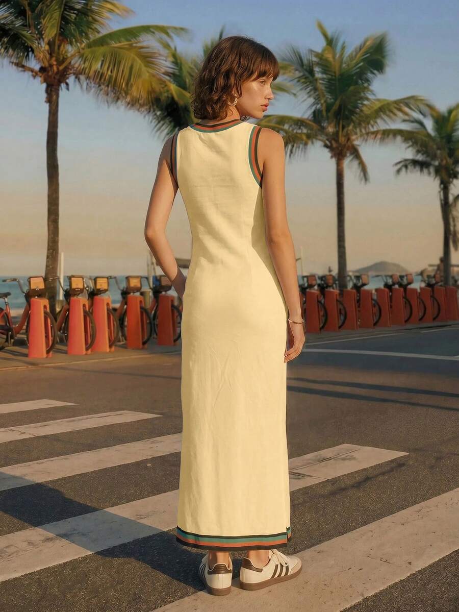 Back view of butter yellow tropical toucan maxi dress by waterfront