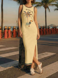 Full front view of butter yellow tropical toucan maxi dress by waterfront