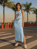 Side front view of baby blue tropical toucan maxi dress by waterfront