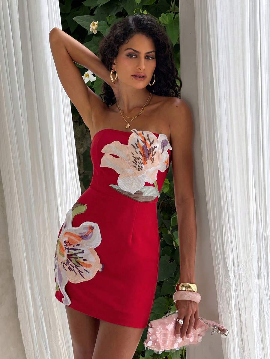 Red sleeveless bodycon mini dress styled with heels for a summer party