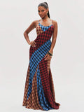 Front view of patchwork plaid maxi dress with cowl neckline, fitted silhouette and flared floor-length hem