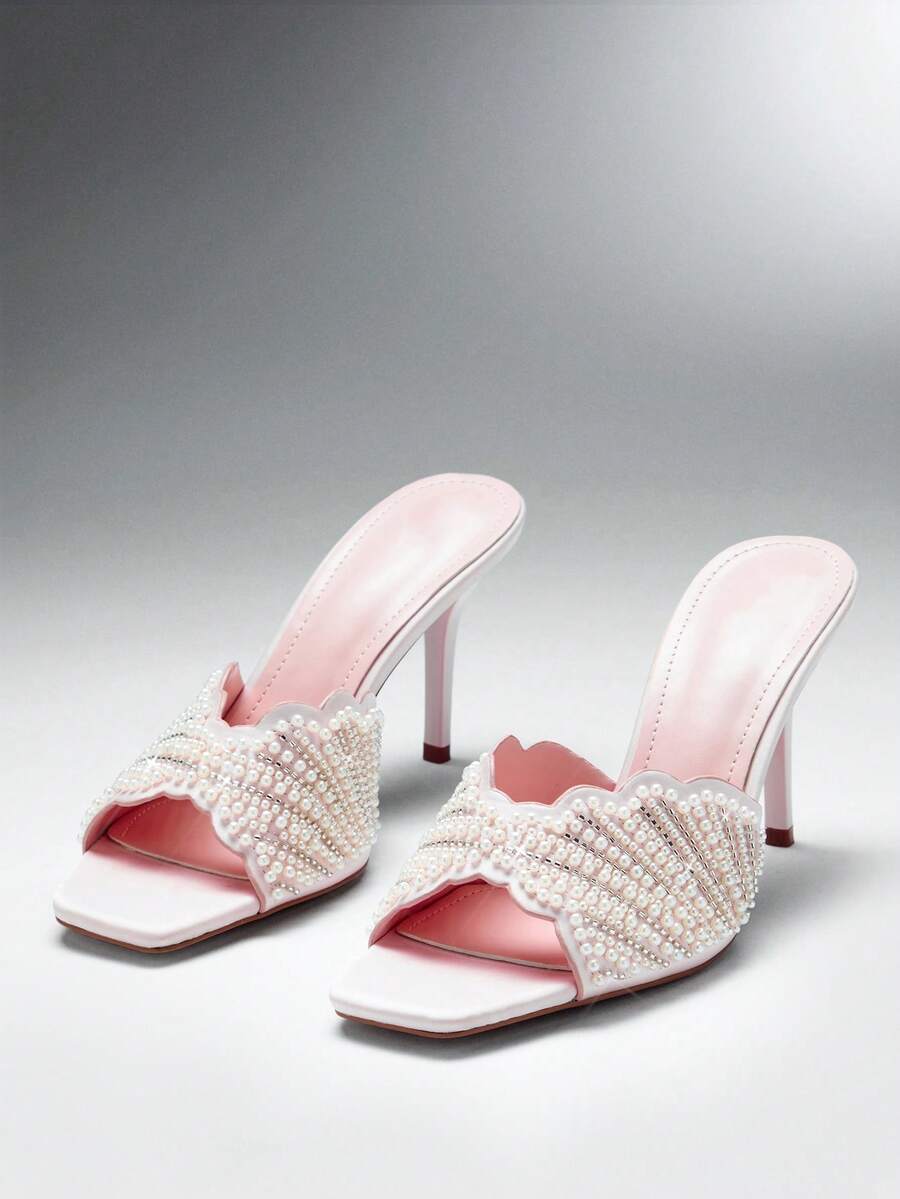 Make a sophisticated statement with these glamorous square toe stiletto sandals for women. Designed with a sleek slip on silhouette, elegant square toe, and slender stiletto heel, these sandals create a refined and feminine look that instantly elevates dressy outfits.