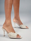 Make a sophisticated statement with these glamorous square toe stiletto sandals for women. Designed with a sleek slip on silhouette, elegant square toe, and slender stiletto heel, these sandals create a refined and feminine look that instantly elevates dressy outfits.