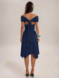 Navy blue two-piece outfit with draped sleeves and handkerchief hem midi skirt