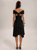 Navy blue two-piece skirt set showing draped sleeves and trailing back sash