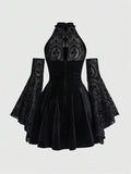 Back view of black gothic halter dress with mesh upper panel, zipper, and flared skirt