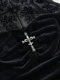 Close-up of black velvet-look bodice with silver-tone cross ornament and flocked mesh