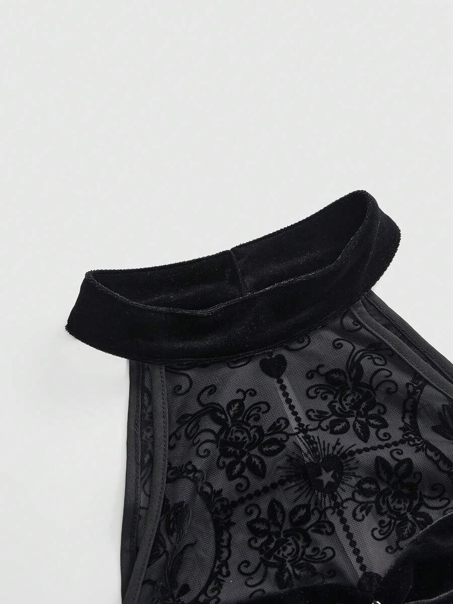 Close-up of black flocked floral mesh halter neckline and velvet collar