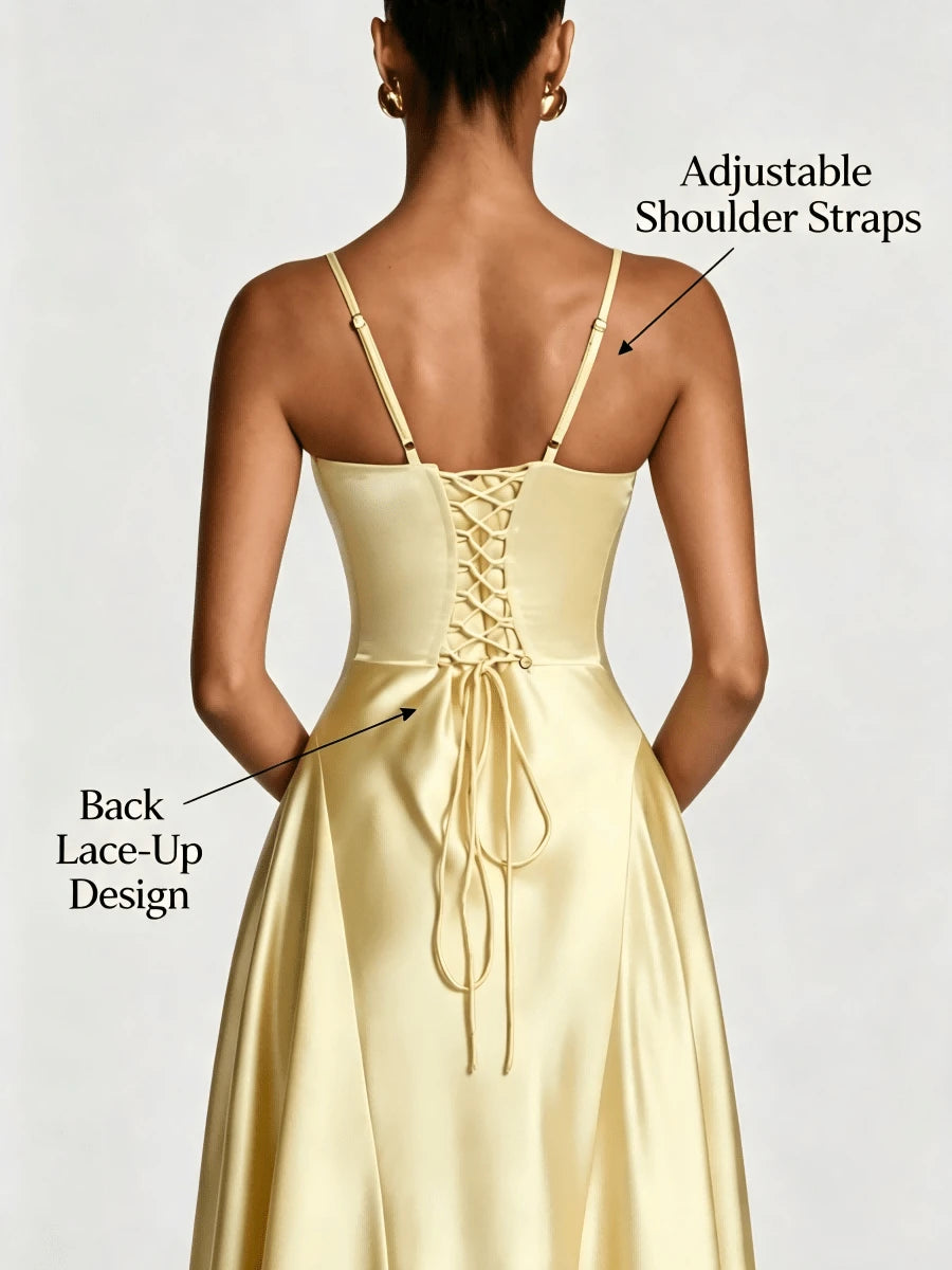Back view of the yellow gown showing adjustable straps and lace-up corset detail