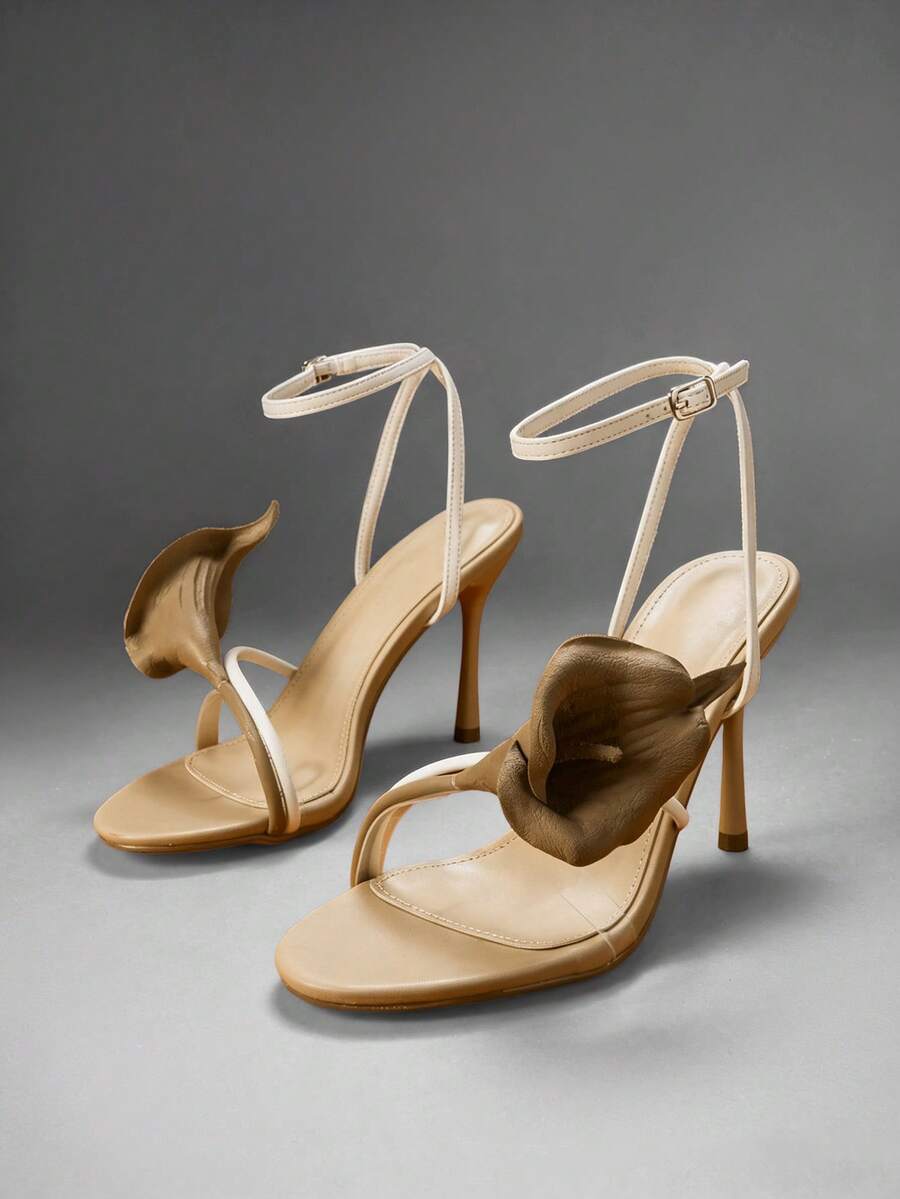 Elegant floral ankle strap stiletto heels for women. Glamorous sandals perfect for weddings, parties, date nights, dinners, and special occasions.
